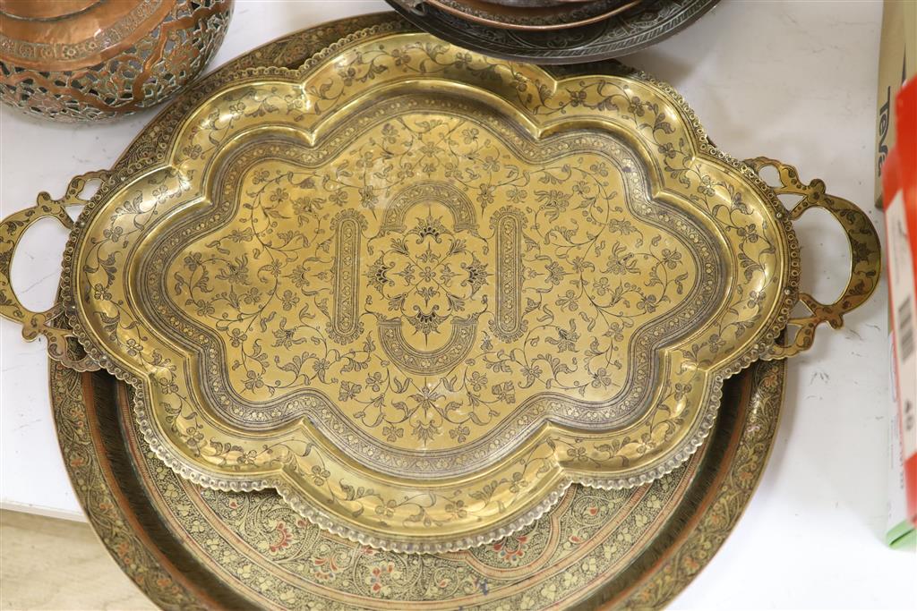 A group of Asian and copper trays, bowls etc